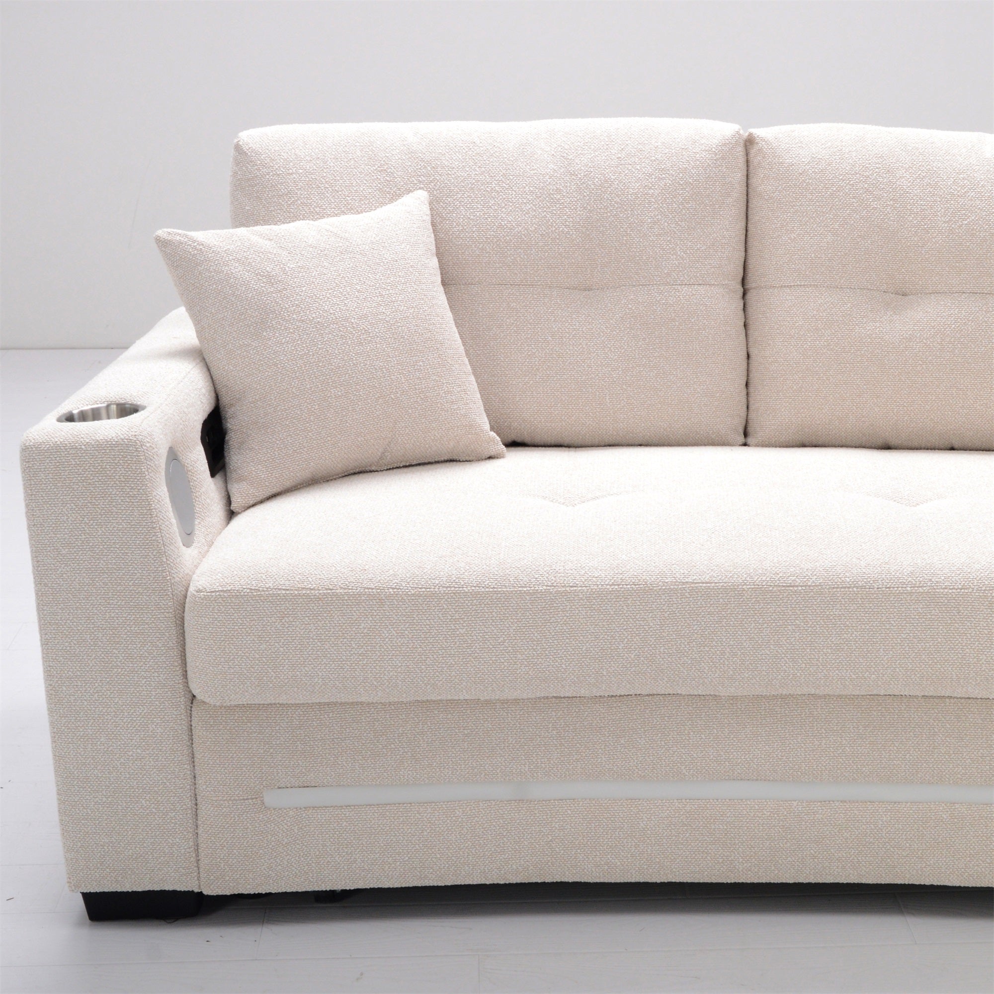 Beige sofa with a decorative pillow