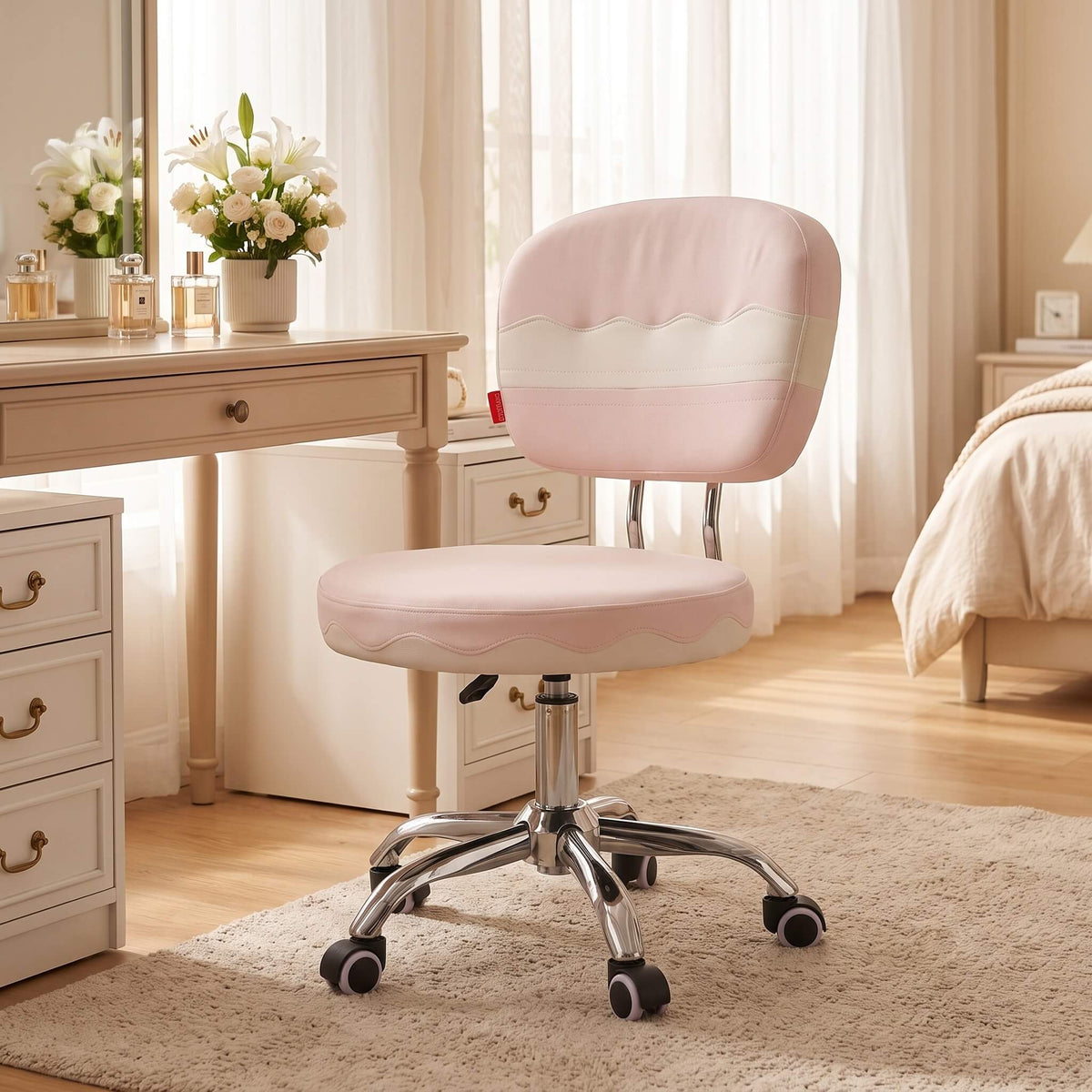 Adjustable height pink vanity chair in front of vanity table