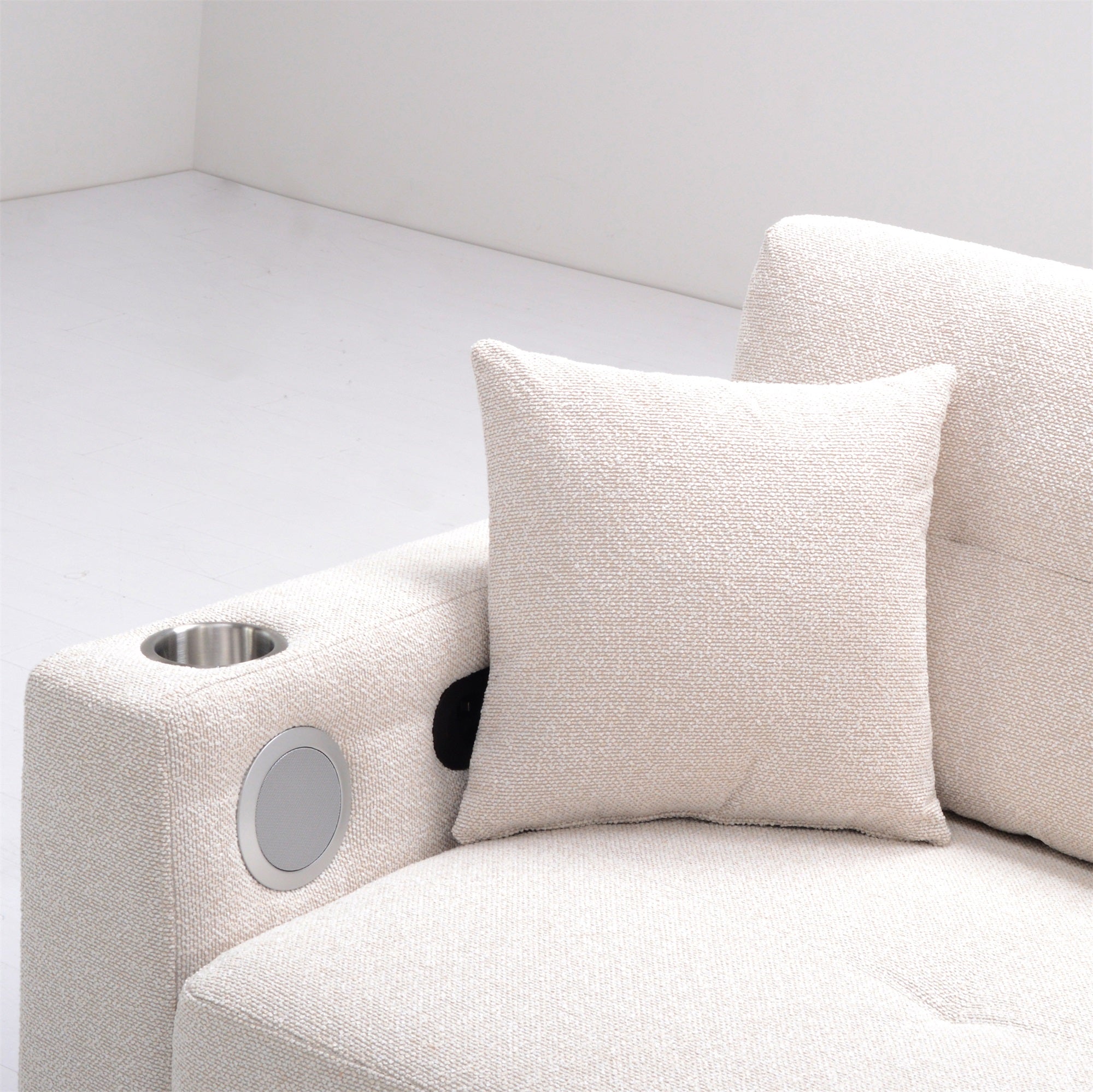 Beige sofa with a decorative pillow