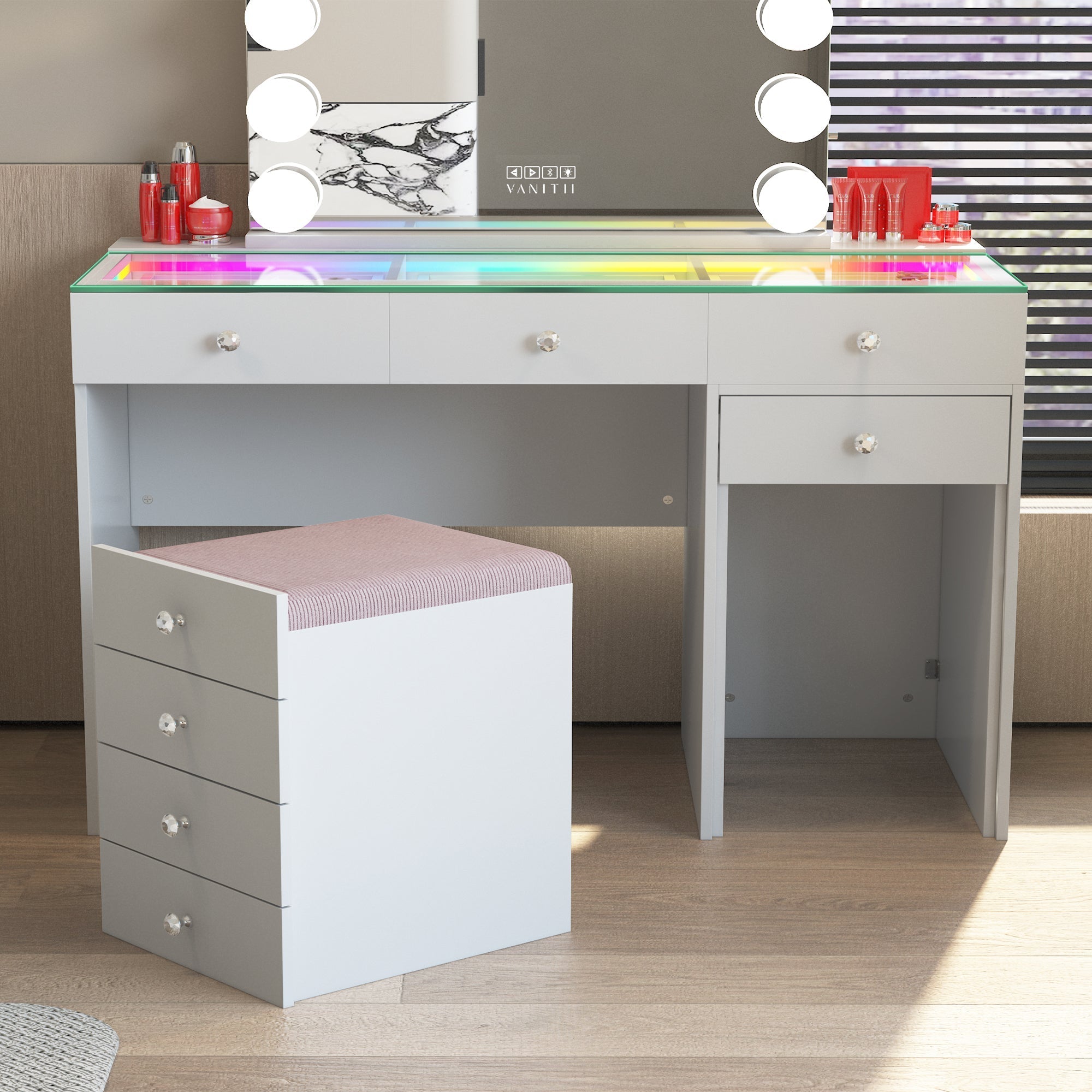 This VANITII Diana Vanity Desk is equipped with 8 storage drawers, a Soft Hidden Stool with storage space, and an RGB adjustable light strip installed in the desktop drawer. It features a simple white design and is placed in the bedroom, being both beautiful and practical.