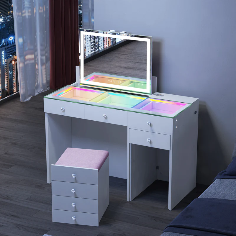 ASCEND Vanity Set featuring an LED makeup mirror, an RGB-illuminated glass countertop, and a matching storage stool, combining makeup display with ample storage space.It is entirely designed in a simple white style.Placed in the bedroom, it perfectly combines fashion and practicality.