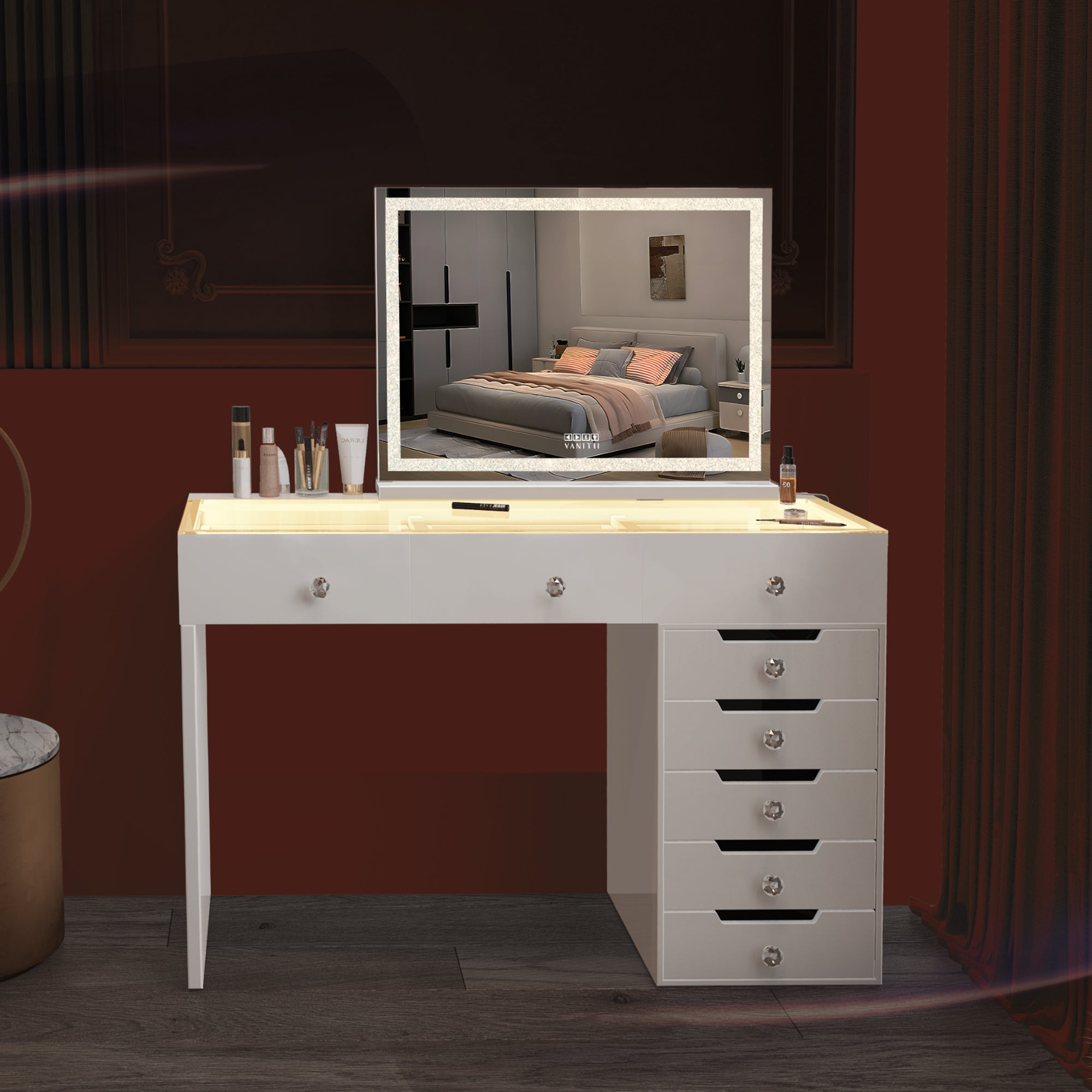 The VANITII Diana Vanity Desk is equipped with 8 drawers with crystal handles, Type-C and USB charging ports, and a glass countertop with 3 adjustable LED light strips of different color temperatures. It features a simple white design and is placed in the bedroom, perfectly combining fashion and practicality.